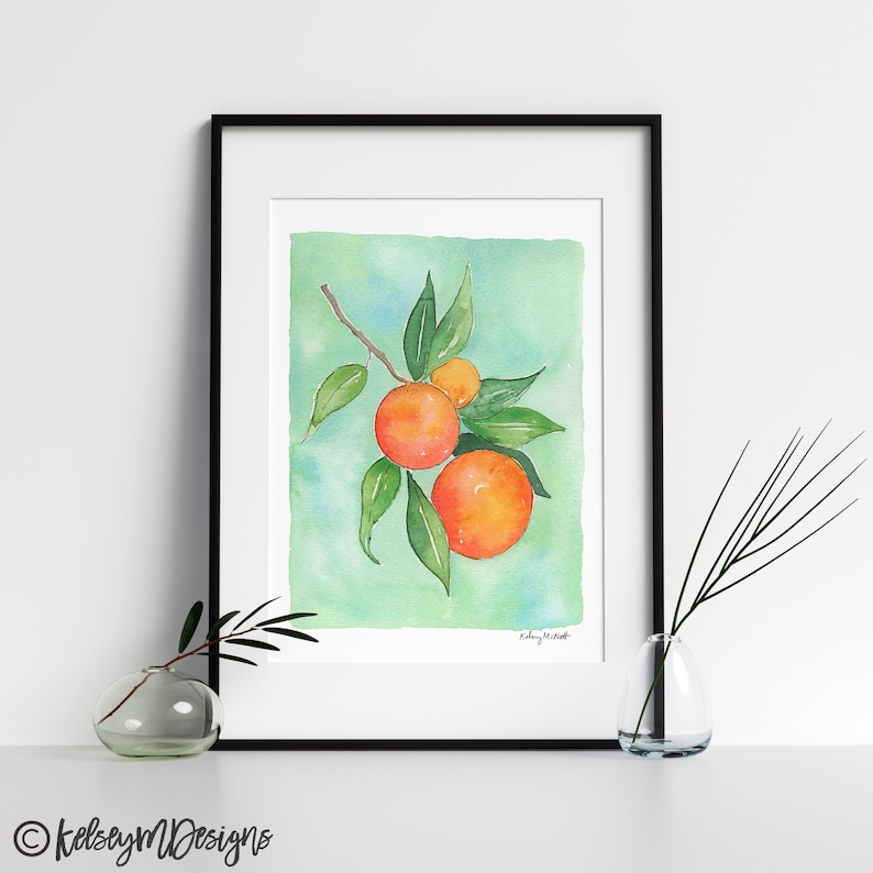 May include: Watercolor painting of a branch with three oranges on a light green background. The oranges are a vibrant orange color with a hint of yellow. The leaves are a deep green.