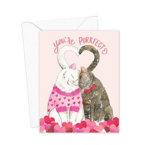 May include: A greeting card with a watercolor illustration of two cats. One white cat wears a pink sweater with red hearts, and the other is gray with a red bow tie. Their tails form a heart shape, with the words "you're purrfect" above them.