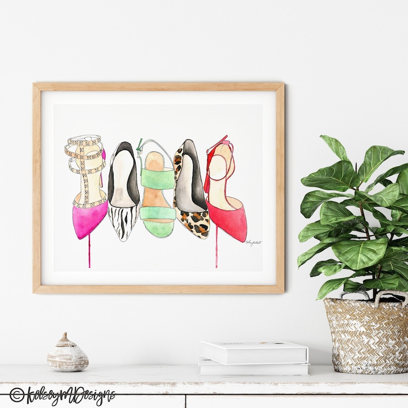 May include: Watercolor painting of five different high-heeled shoes. The shoes are in a row, from left to right: pink with gold accents, black and white zebra print, green with gold accents, leopard print, and red. The shoes are all painted in a realistic style.