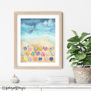 May include: A watercolour painting of a beach scene with colourful umbrellas and a small boat in the ocean. The painting is framed in a light wood frame.