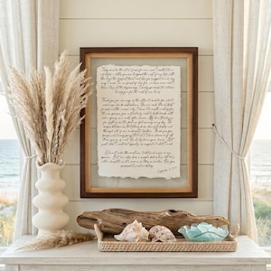Framed anniversary gift featuring personalized wedding vows printed on handmade deckled-edge cotton paper in a walnut float frame.