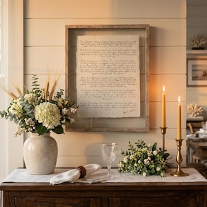 Personalized first anniversary gift showcasing wedding vows on handmade deckled-edge paper in a modern wood frame.
