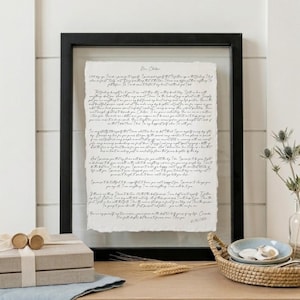 Custom anniversary keepsake with wedding vows displayed on handmade cotton paper and framed in a luxury walnut float frame.