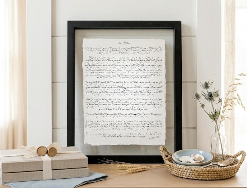 Custom anniversary keepsake with wedding vows displayed on handmade cotton paper and framed in a luxury walnut float frame.