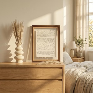 Framed anniversary gift featuring personalized wedding vows printed on handmade deckled-edge cotton paper in a walnut float frame.