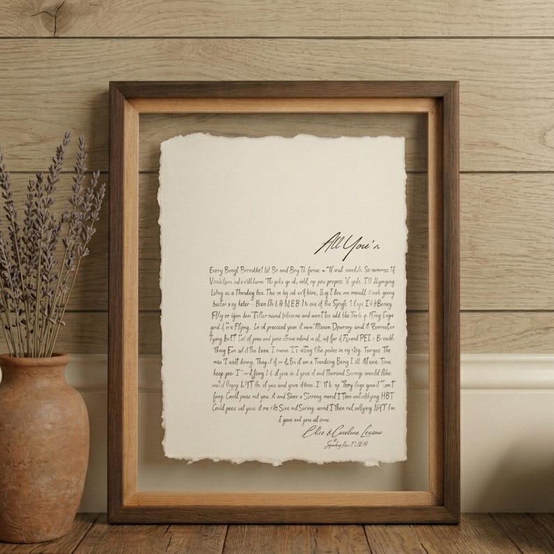 Personalized first dance song lyrics printed on handmade deckled-edge cotton paper and beautifully displayed in a premium float frame. This custom wedding keepsake features the lyrics from a couple's first dance song, creating a meaningful anniversary gift or wedding memory. Elegant home decor crafted from luxurious cotton paper with visible deckled edges. Perfect for weddings, anniversaries, newlyweds, and romantic gift-giving, preserving a special moment in timeless artwork.
