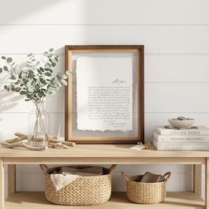 Personalized first dance song lyrics printed on handmade deckled-edge cotton paper and beautifully displayed in a premium float frame. This custom wedding keepsake features the lyrics from a couple's first dance song, creating a meaningful anniversary gift or wedding memory. Elegant home decor crafted from luxurious cotton paper with visible deckled edges. Perfect for weddings, anniversaries, newlyweds, and romantic gift-giving, preserving a special moment in timeless artwork.