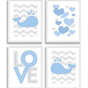 May include: Set of four framed prints with a blue whale and chevron pattern, a blue whale with water droplets, a blue whale with hearts, and the word "LOVE" in blue and gray.