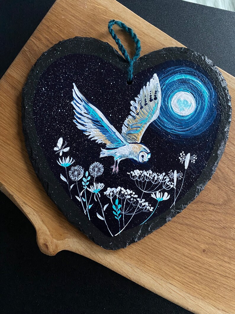 Barn Owl in flight above wild flowers, with the full moon in the sky. Hand painted on a 18cm slate heart. Celebrating British wildlife image 1