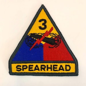 May include: A set of three ceramic mugs with a speckled, cream-colored glaze. Each mug features a different hand-painted floral design in shades of blue, green, and yellow. The mugs have a simple, modern shape.