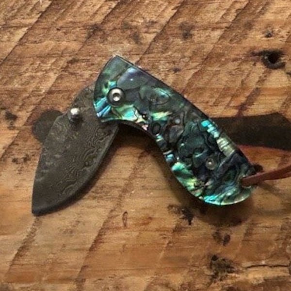 Abalone Folding Pocket Knife with Damascus drop point blade, thumbscrew opening, lanyard, file work on the spine, composite cover on handle
