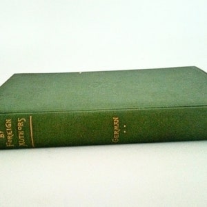 May include: A green hardcover book with gold lettering on the spine. The title is "Stories by Foreign Authors: German".