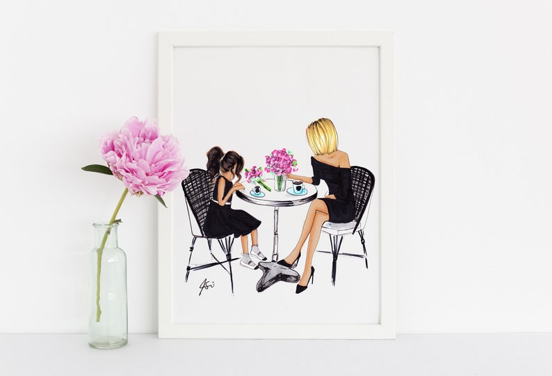 May include: A framed illustration of two people, a woman and a girl, sitting at a table with pink flowers. They are both wearing black dresses and are drinking from cups. The woman has blonde hair and the girl has brown hair.