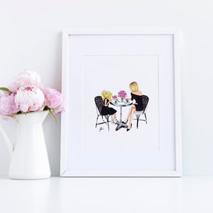 May include: A framed illustration of two people sitting at a table with flowers. The people are wearing black dresses and are looking at each other. The illustration is in a white frame.