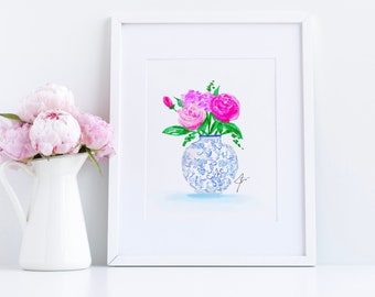 May include: A watercolor painting of pink peonies in a blue and white porcelain vase. The vase has a floral pattern and is sitting on a white surface.