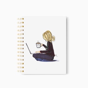 May include: Spiral-bound notebook with a watercolor illustration of a person sitting cross-legged, working on a laptop, and holding a coffee mug. The mug reads "Coffee Vibes". The notebook has a gold spiral binding.