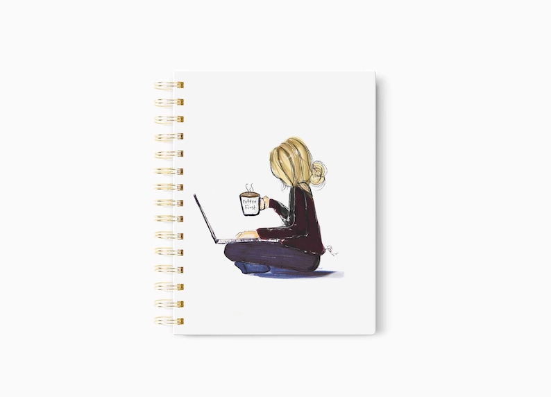 May include: Spiral-bound notebook with a watercolor illustration of a person sitting cross-legged, working on a laptop, and holding a coffee mug. The mug reads "Coffee Vibes". The notebook has a gold spiral binding.