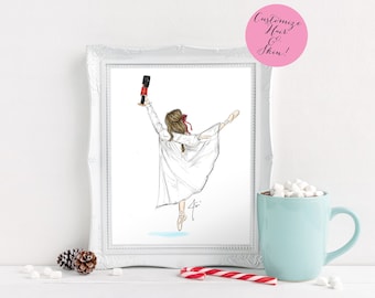 May include: A framed illustration of a ballerina holding a nutcracker, wearing a white nightgown and pointe shoes. The artwork is in a white frame, with a pink circle that says "Customize Hair & Skin!". A light blue mug, candy cane, and pine cones are in the foreground.