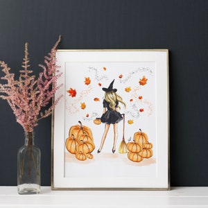May include: A witch in a black dress and a pointed hat walks through a field of pumpkins. The witch is holding a broom and a small pumpkin. The background is a white watercolour wash with autumn leaves and sparkles.