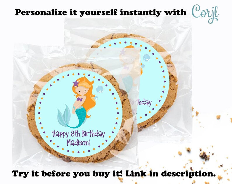 May include: A personalized cookie favor bag with a blue and purple mermaid sticker. The sticker says "Happy 6th Birthday Madison!" and has a mermaid with orange hair and a purple starfish on her head. The bag is clear plastic and has a brown cookie inside.