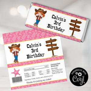 May include: Pink and yellow candy bar wrapper featuring a cartoon girl wearing a cowboy hat and boots. The wrapper reads "Calvin's 3rd Birthday" and includes a signpost with the words "Silvercity, Wild West, El Dorado".