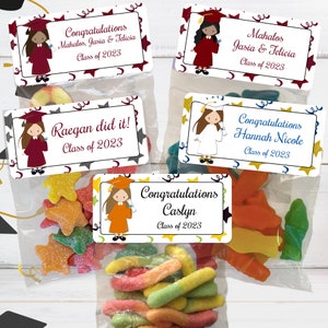May include: Four graduation party favor bags with colorful candy and personalized labels. The labels feature a cartoon graduate with a cap and gown, and the text "Congratulations", "Mahalos", "Raegan did it!" and "Caslyn".