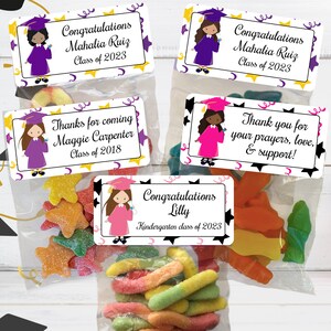 May include: Four graduation party favor bags with colorful candy and personalized labels. The labels feature a cartoon girl in a graduation cap and gown, with the text "Congratulations Mahalia Ruiz Class of 2023", "Thanks for coming Maggie Carpenter Class of 2018", "Congratulations Lilly Kindergarten class of 2023", and "Thank you for your prayers, love, & support!"