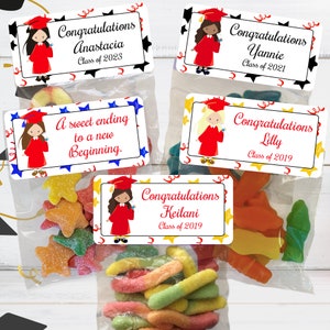 May include: Four graduation gift bags with colorful candy and personalized labels. The labels feature a cartoon girl wearing a graduation cap and gown. The labels include the names Anastacia, Yannie, Lilly, and Keilani, along with their graduation year.