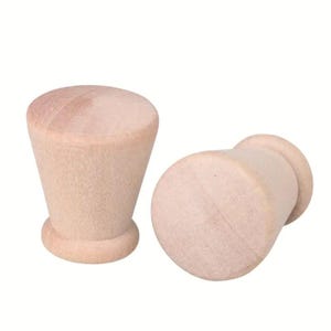 May include: Two unfinished wooden knobs, one round and one cone-shaped.