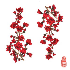 May include: Two red floral embroidery designs with gold accents. The designs feature branches with red flowers and leaves. The text "春 霞 錦" is visible in the bottom right corner of the image.