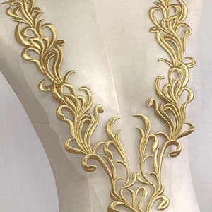 Puede incluir: Borde de encaje bordado en oro con un delicado diseño floral. Este borde es perfecto para añadir un toque de elegancia a cualquier proyecto.