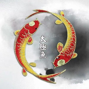 May include: Two red and yellow embroidered koi fish swimming in a circle. The fish are facing each other and the text "大鯉魚" is written in black in the centre of the circle.