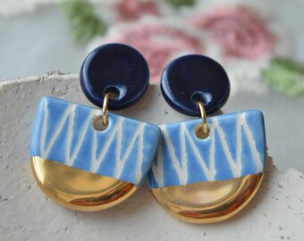 Handmade ceramic semicircle earrings in blue and gold
