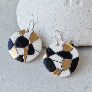 Geometric ceramic earrings in black, white and gold