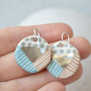 Handmade ceramic earrings in blue and silver