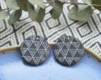 Black drop earrings with minimalist white geometric pattern, handmade ceramic jewelry