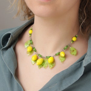 Yellow glass lemon necklace • Botanical green leaf beaded fruit jewelry • Blown glass modern statement