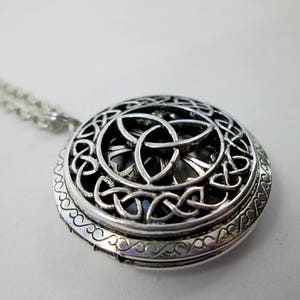 close-up shot of trinity knot locket showing details of Celtic knots