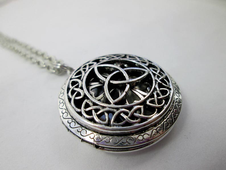 close-up shot of trinity knot locket showing details of Celtic knots