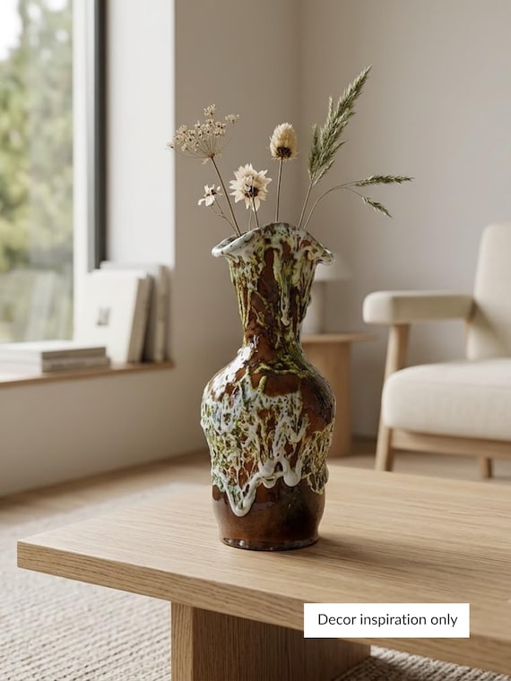 Chunky, textured fat lava glaze in the raw Vallauris French tradition — the kind of brutalist pottery that stops you mid-scroll and looks like it belongs in a 1960s French designer's studio.