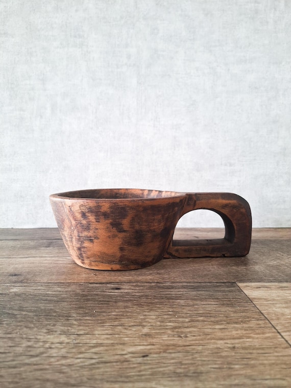 Antique single-handle carved wood mortar with genuine French farmhouse provenance — the handle and mortar form make it a sculptural kitchen-to-shelf crossover object.