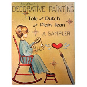 May include: Vintage book cover titled "Decorative Painting" featuring a woman in a blue dress seated in a red rocking chair. The cover includes the text "Tole and Dutch and Plain Jean A Sampler" and a painted heart with a paintbrush.