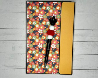 Disney Travel & Adventure Themed Refillable Notepad Holder with Pocket and Beaded Pen (trav/adv112)