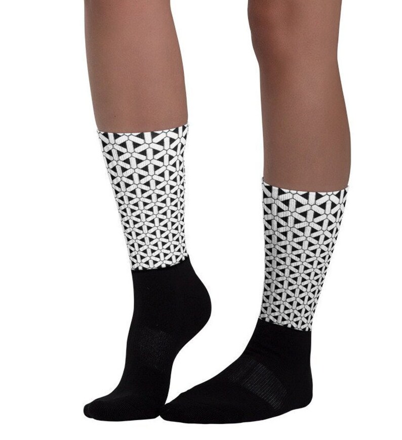 Designer Unisex Socks from Ben More with black sole and artwork leg.