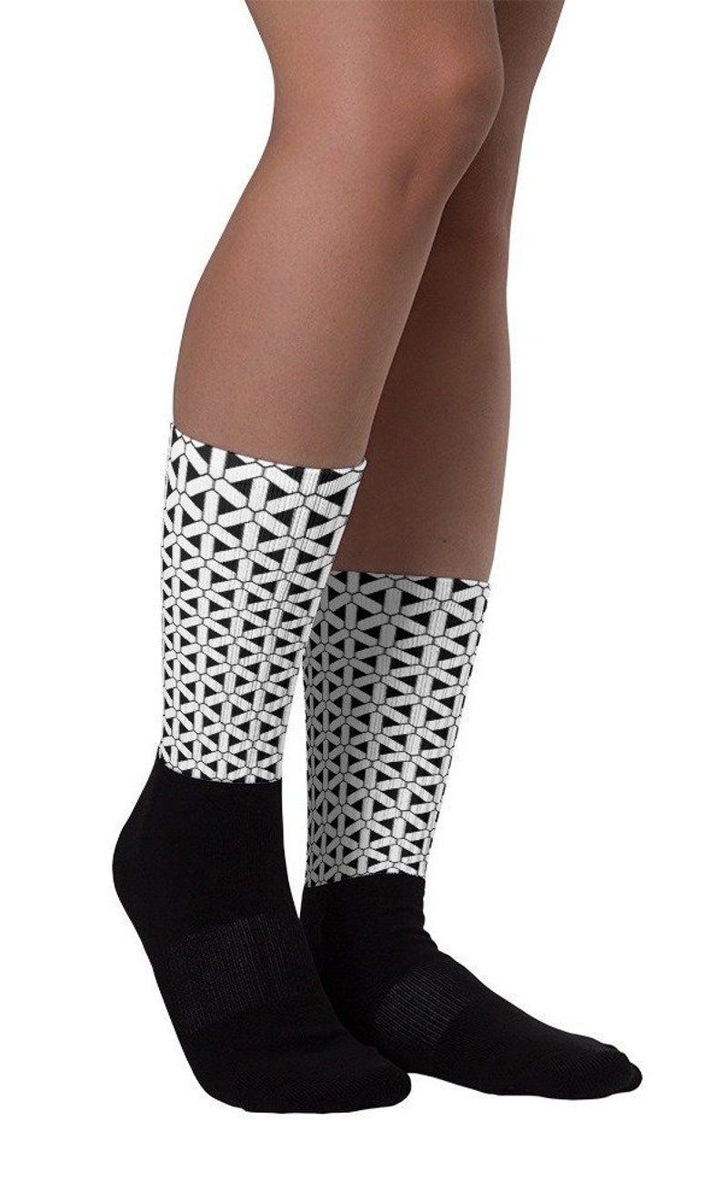 Designer Unisex Socks from Ben More with black sole and artwork leg.
