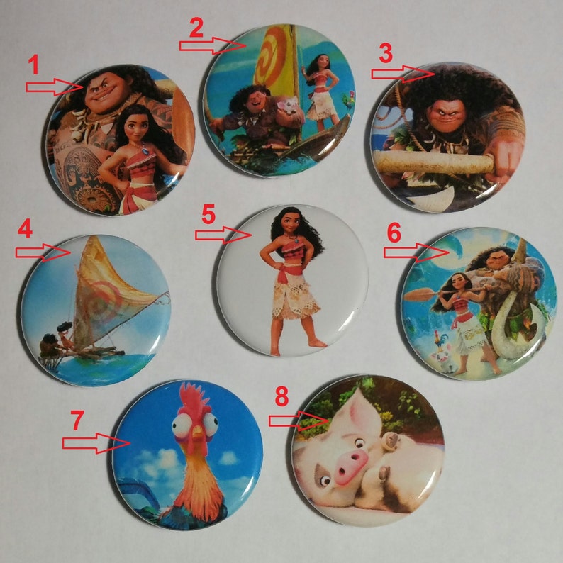 May include: A collection of eight round pinback buttons featuring characters from the animated film "Moana." The buttons display images of Moana, Maui, Hei Hei, Pua, and scenes from the movie, with vibrant colors and detailed illustrations.