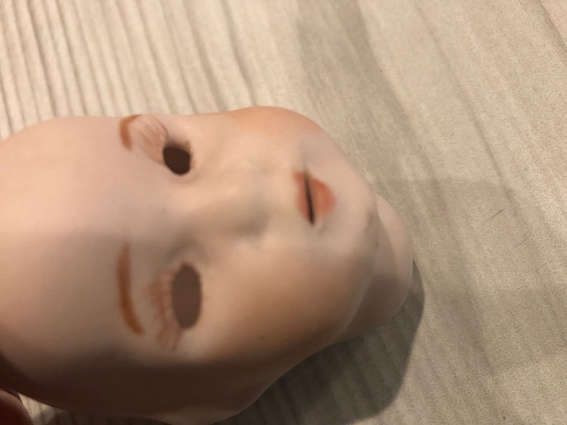 Vintage porcelain doll head