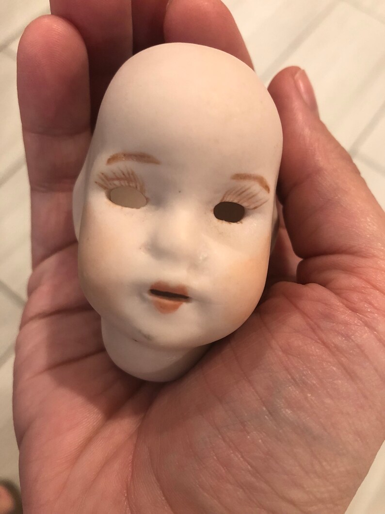 Vintage porcelain doll head