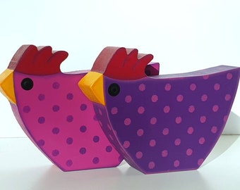 two good mood chickens made of wood in purple pink table decoration Easter Easter egg dots