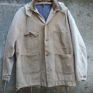 Jaren 60 Carhartt Rare Grunge Jacket Hooded Chore Coat met kinwarmer maat 46 Uniek Love it or leave it Movie Film Streetwear